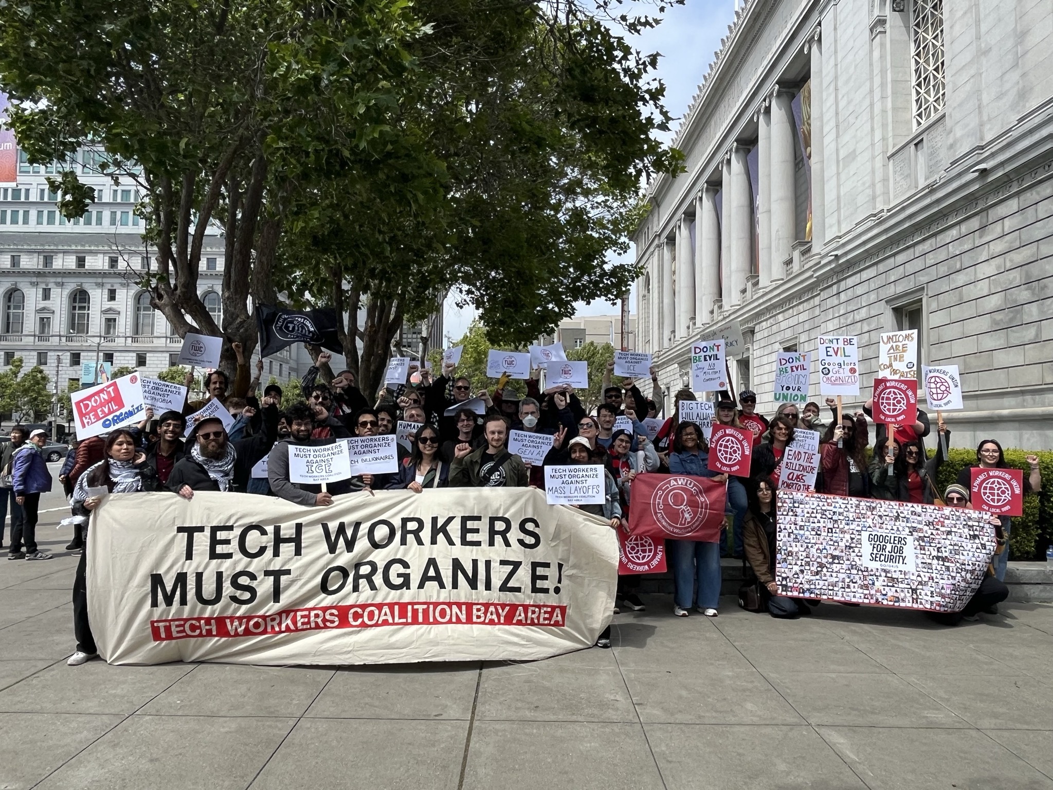Group photo from 2026 TWC Bay Area May day rally with banner: Tech Workers Must Organize!